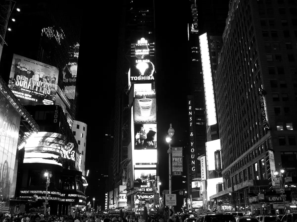 Digital advertising screens lighting a city at night