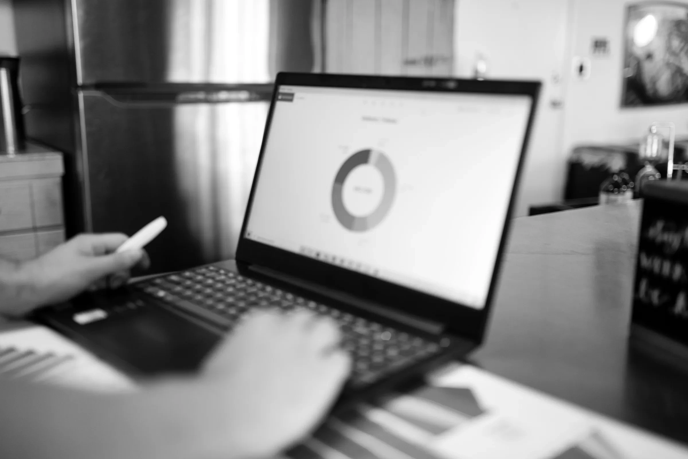 Reviewing campaign charts on a laptop