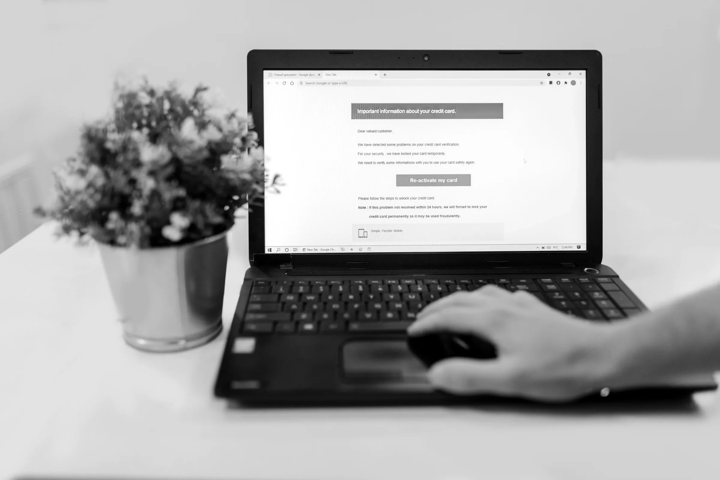 Reading a marketing email on a laptop at a desk