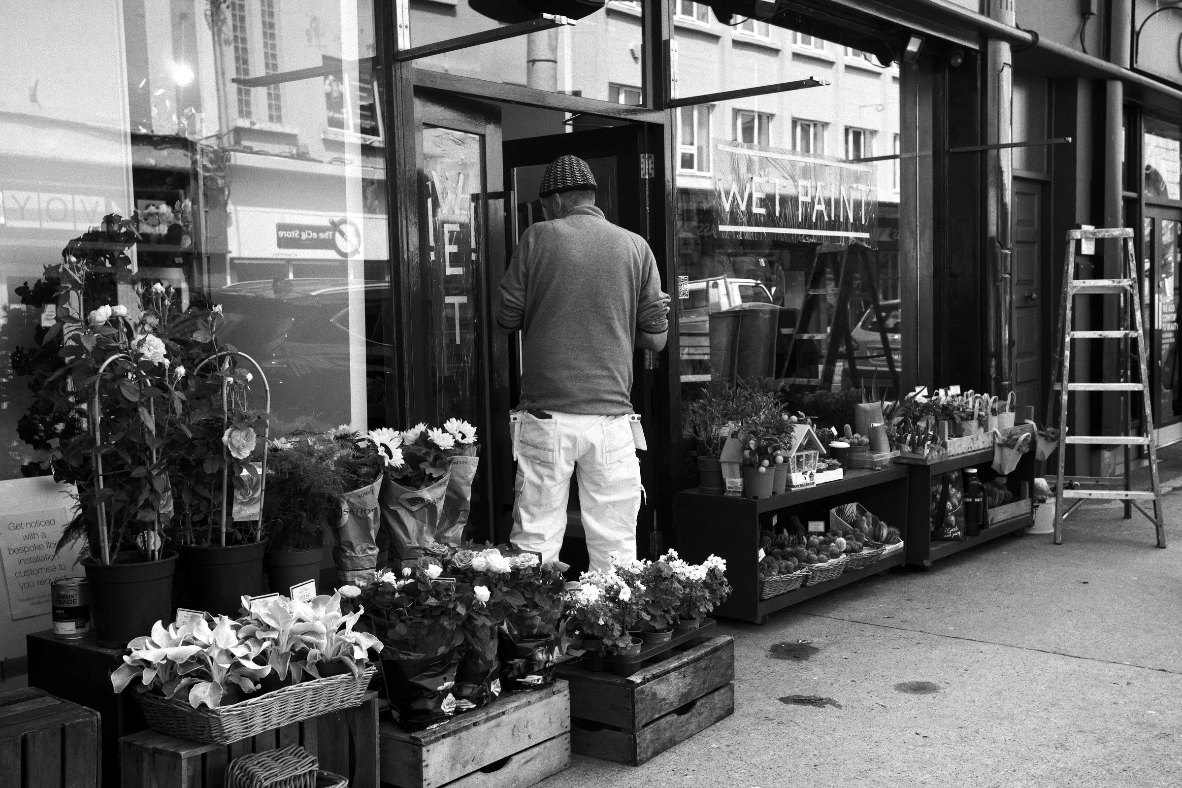 A florist's storefront welcoming passers-by