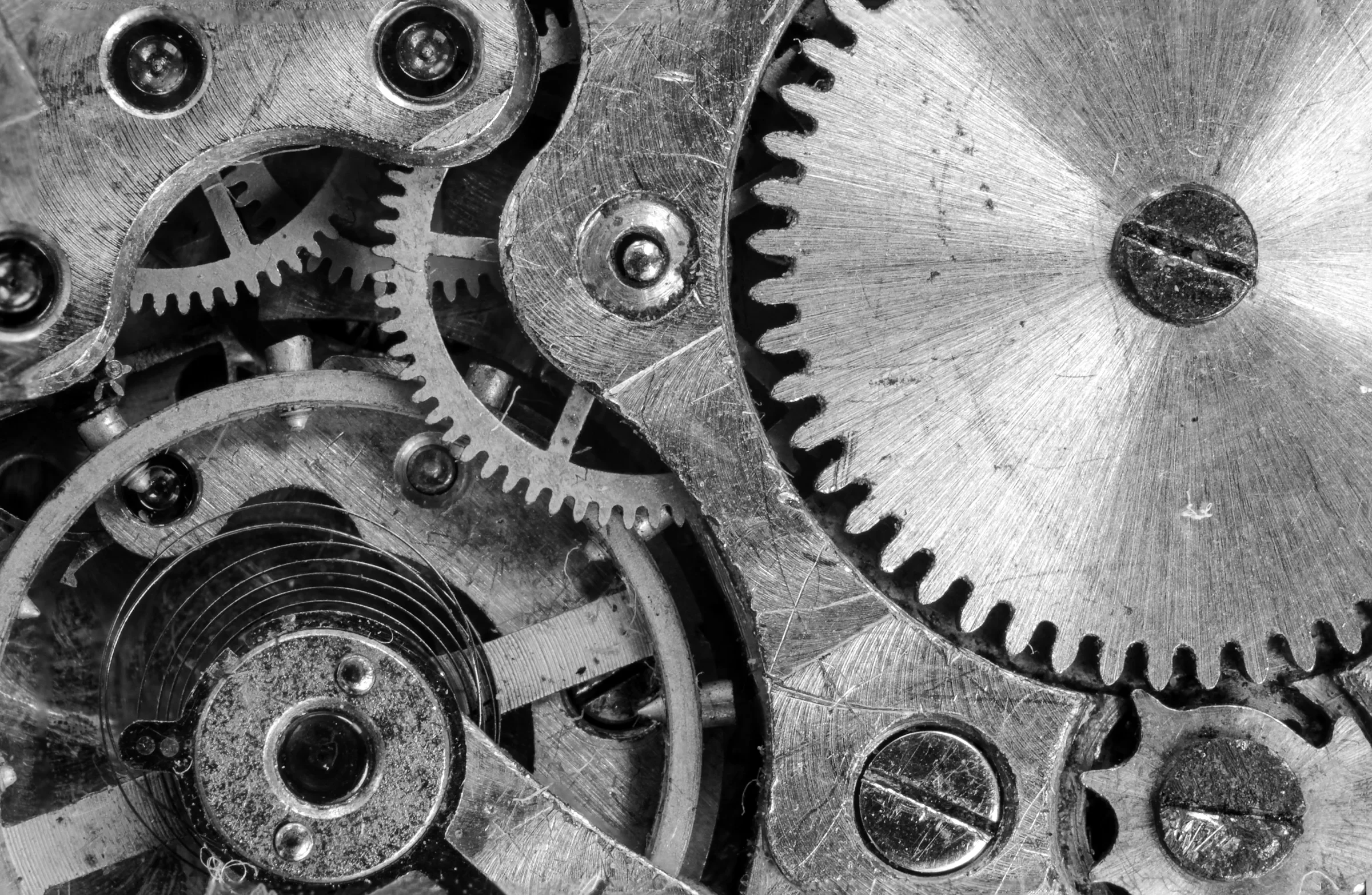 Clockwork gears meshing in close-up