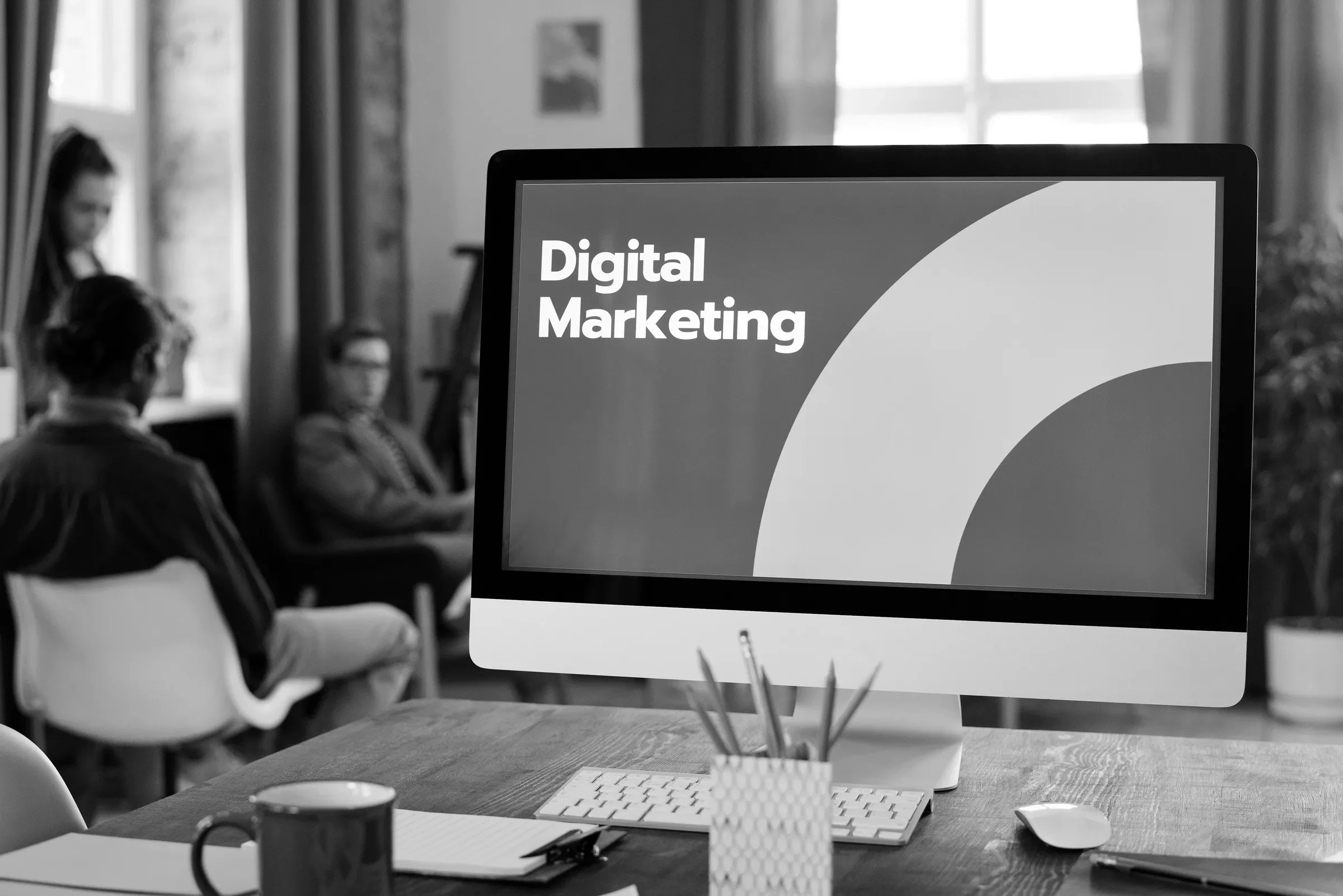 A marketing team reviewing a campaign on screen