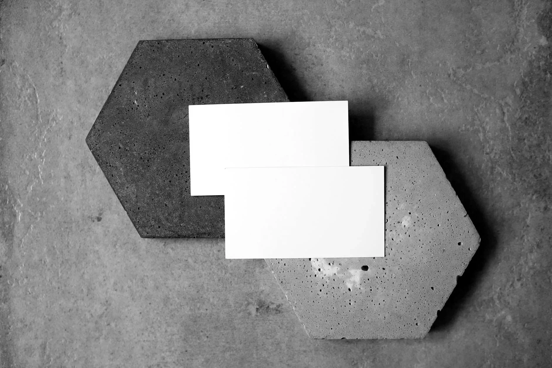 Blank business cards laid out on a textured surface