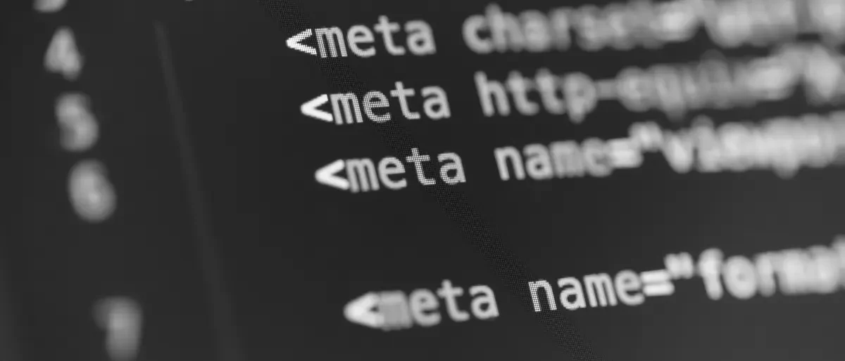 Close-up of website meta tags in a code editor