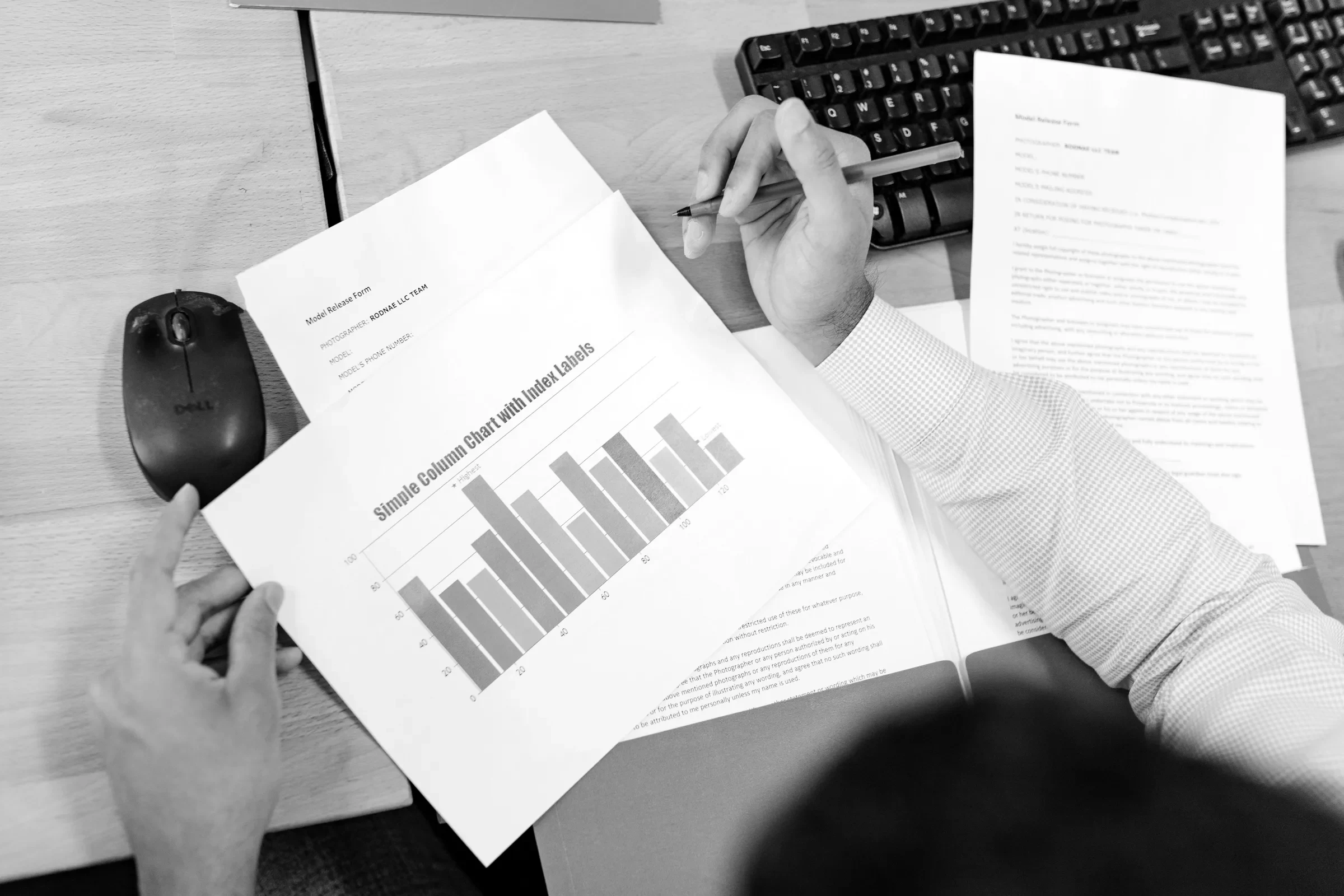 Reviewing printed performance charts at a desk