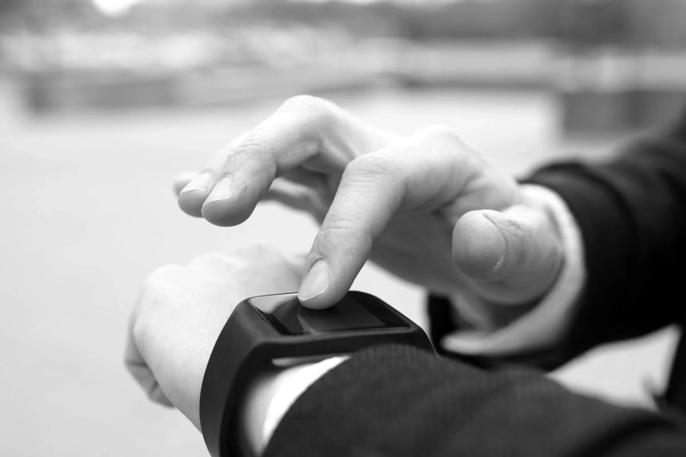 A person checking a smartwatch on their wrist