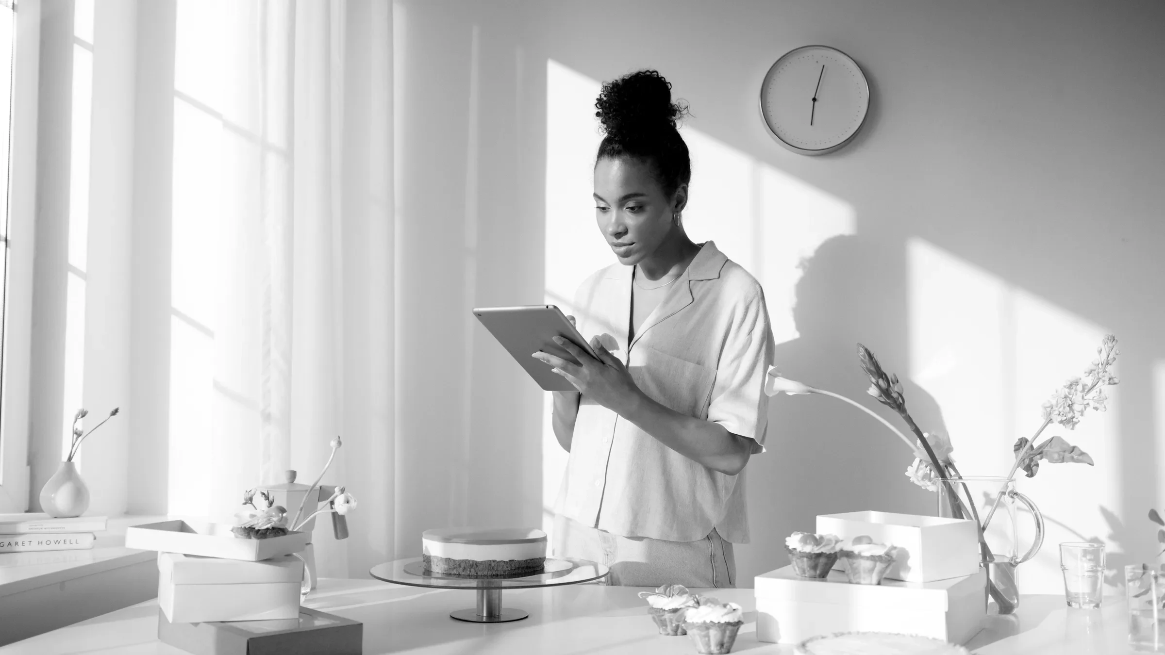 A home business owner managing orders on a tablet