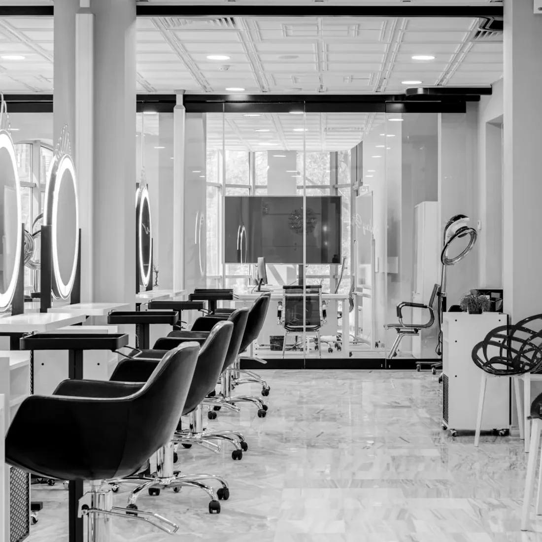 The styling chairs and mirrors of a hair salon