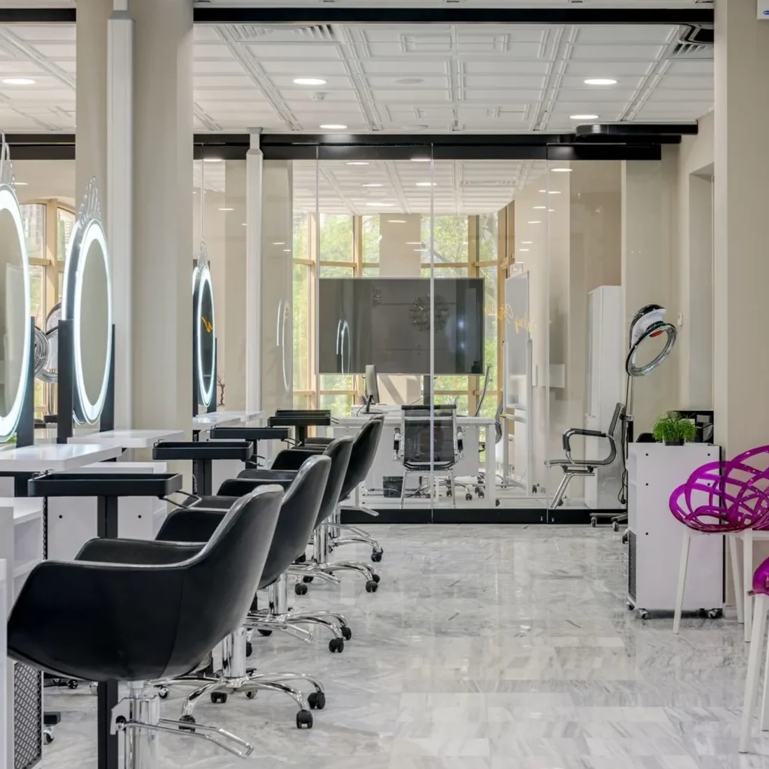The styling chairs and mirrors of a hair salon